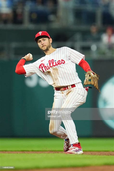 Trea Turner Of The Philadelphia Phillies Throws The Ball To First