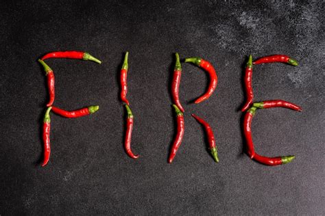 Premium Photo Bright Red Chilli Pepper On A Grey Concrete Background