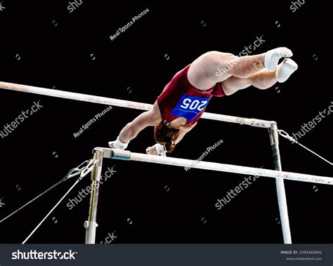 Female Gymnast Exercise On Uneven Bars Stock Photo 2291642691 | Shutterstock