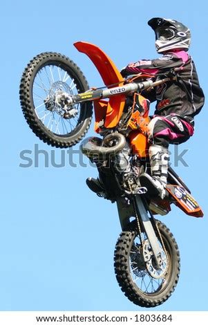 A Stunt Rider Doing Tricks On His Dirt Bike Stock Photo 1803684 ...