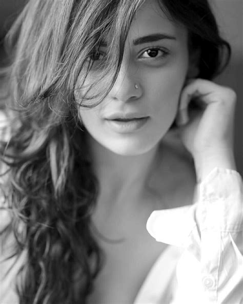 Black And White Photograph Of A Woman With Long Hair Wearing A Shirt