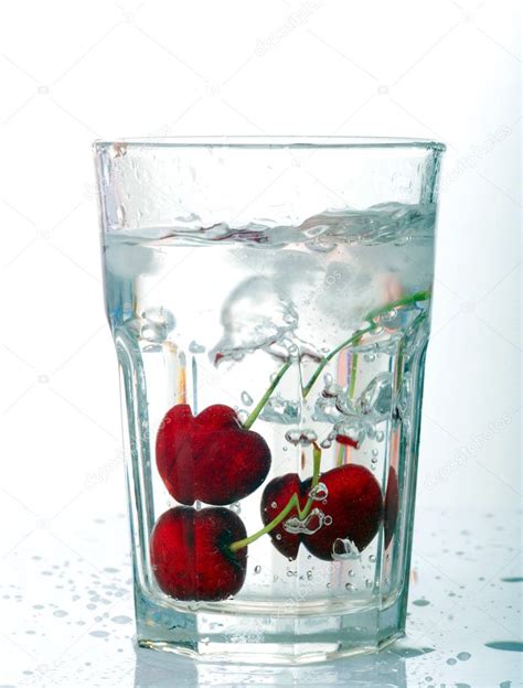 Beaker With Water And Cherries Stock Photo By ©oknazarenko 1249649