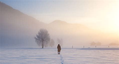 Person Walking On Snow Covered Field During Daytime HD Wallpaper Peakpx