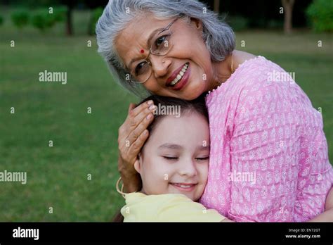 Grandmother And Granddaughter Hugging Stock Photo Alamy