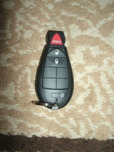 Sell NEW MOPAR KEYLESS ENTRY TRANSMITTER 68079805AA SS TO 56046706AD In