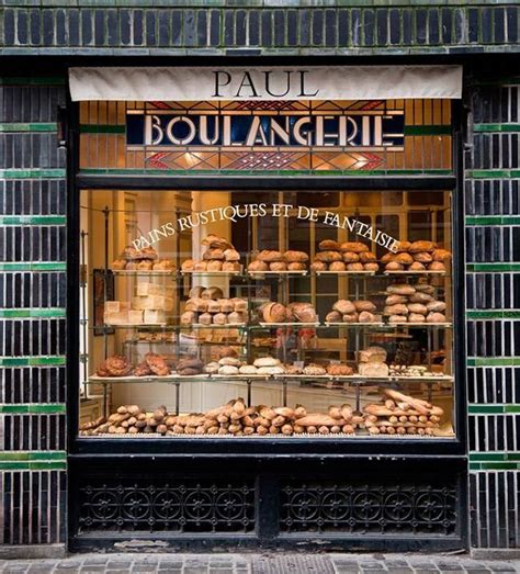 A Bakery With Lots Of Baked Goods On Display In The Window And Behind