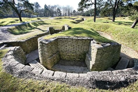 An Old Brick Structure In The Middle Of A Field