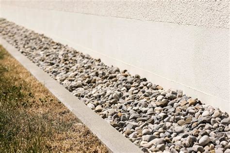 Premium Photo Drainage Gravel Drain Stones Pebble Around Wall Of