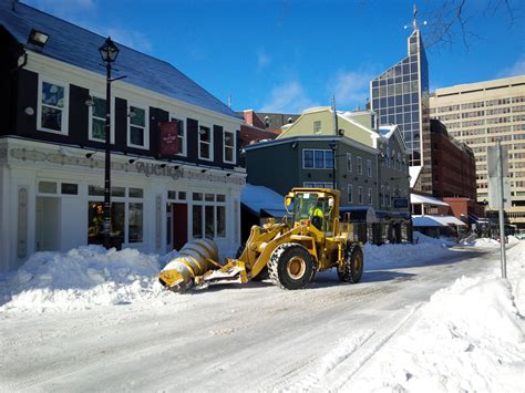 A plow works to clear snow off of Argyle St. in Halifax after Monday ...