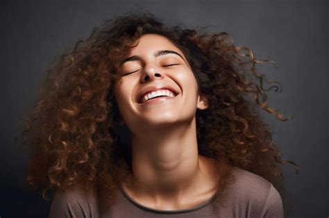 Premium Photo An African American Woman With Curly Hair Smiles And