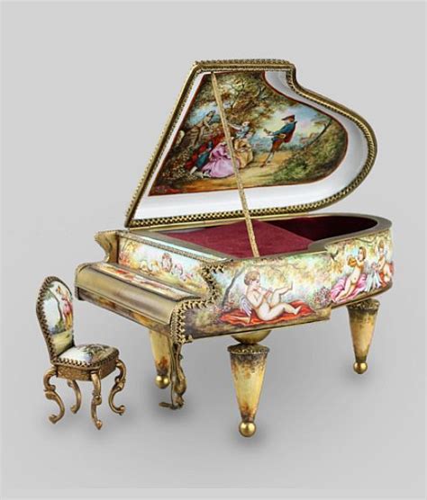 An Elaborately Painted Grand Piano With Matching Stools