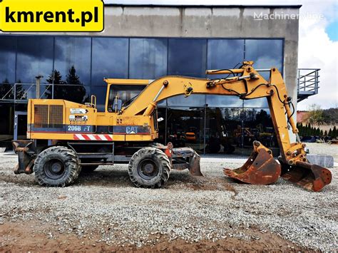 Escavatore gommato CATERPILLAR 206 BFT KOPARKA KOŁOWA KOMATSU PW 140