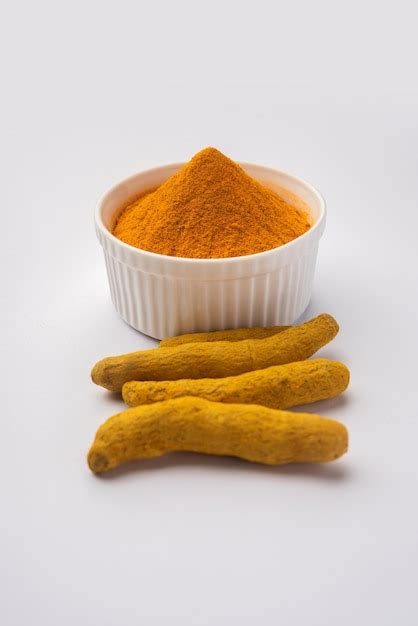 Premium Photo Dry Turmeric Dust Or Haldi Powder Also Known As Curcuma