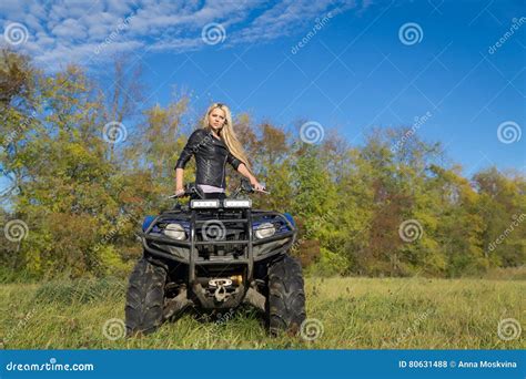 Elegant Blonde Woman Riding Extreme Quadrocycle Atv On Summer Field