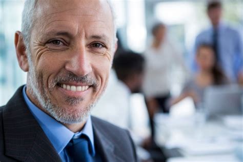 Premium Photo | Smiling businessman at office