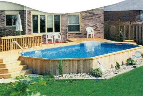 An Above Ground Pool With Steps Leading Up To It And A Deck In The Background