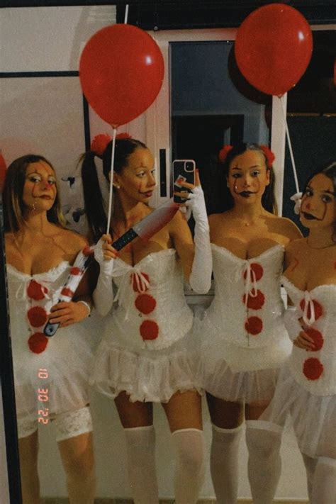 Four Women Dressed In White And Red Posing For A Photo With Balloons On