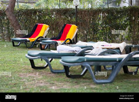 Towels In The Colours Of The German Flag Are Used To Reserve Sun