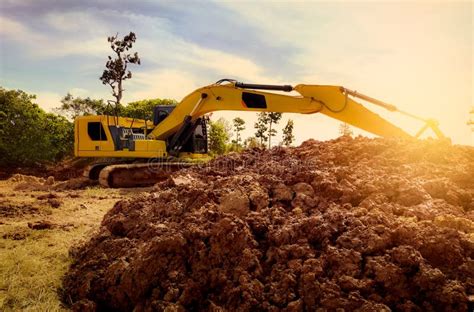 Backhoe Working By Digging Soil At Construction Site Excavator Digging