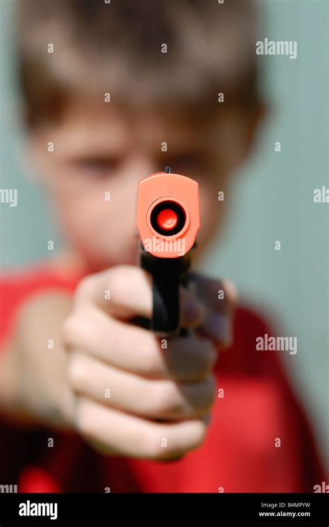 boy with a toy gun Stock Photo - Alamy