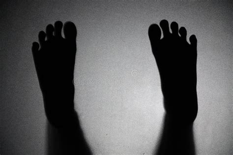 Shadow Feet Of The Little Girl Behind Frosted Glass Stock Photo Image