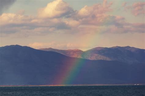 Premium Photo | Rainbow in mountains