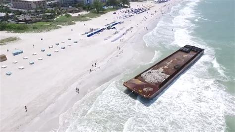 Storm leaves 40-ton barge on St. Pete beach