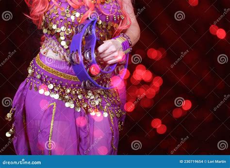 Belly Dancer Wearing Purple Dance Costume Close Up With Bokeh Stock