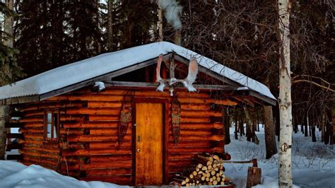 Winter log cabin in Alaska - backiee