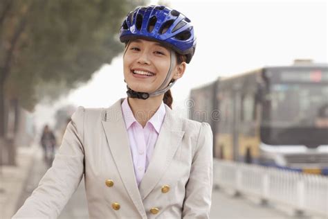 Young Business Woman Commuting With A Bicycle Beijing China Stock