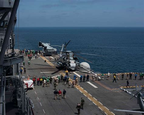 Sailors And Marines Onboard The Amphibious Assault Ship Uss Makin