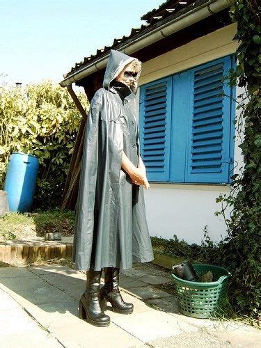 Inspecting The Garden In Her Grey Klepper Cape Rainwear Girl