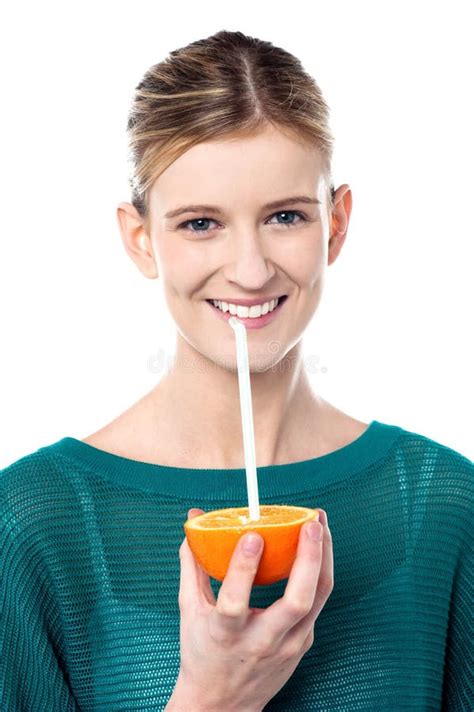 Girl Sipping Orange Juice Through Straw Stock Image Image Of