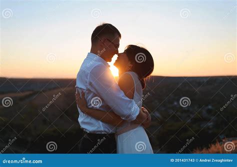 Happy Hugging Couple at Sunset Stock Image - Image of outdoor ...