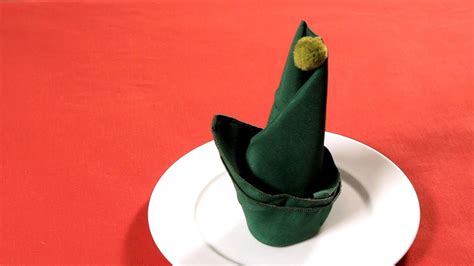 How To Fold A Napkin Into An Elf Hat Napkin Folding Youtube