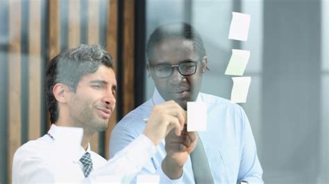 Premium Photo Two Businessmen Discussing Business Strategy Standing