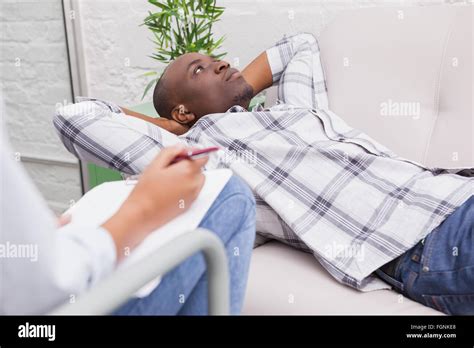 Man Lying On Sofa Talking To His Therapist Stock Photo Alamy