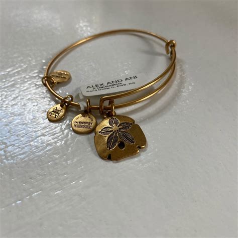 Never Worn Alex And Ani Gold Sand Dollar Charm Depop