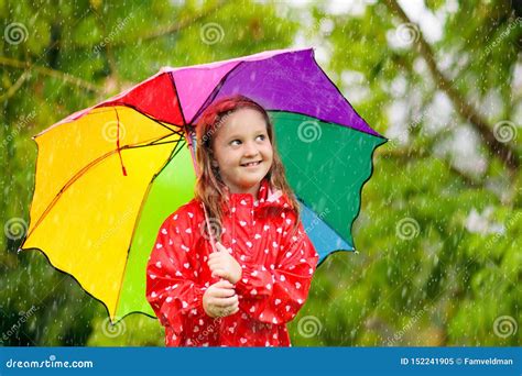 Kid with Umbrella Playing in Summer Rain Stock Image - Image of kids ...