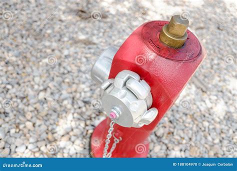 Red Metal Fire Hydrant On The Street In An Industrial Area For Fire