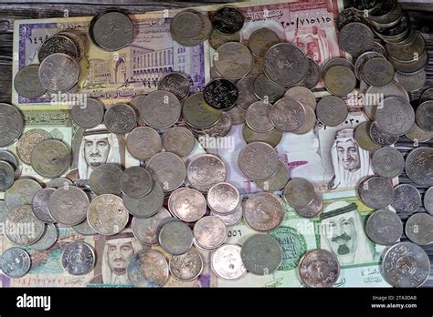 Saudi Arabia riyals money banknote bills and coins of different eras ...