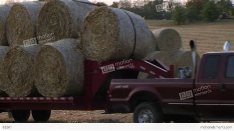 Trucks Hauling Hay Bales Stock Video Footage 83261