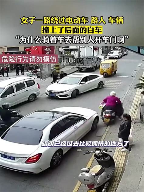 女子骑电动车经过狭隘路段，不料下一秒撞向前方白车