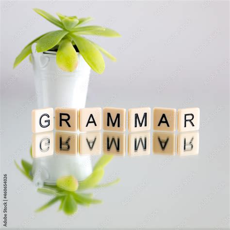 grammar. Language, knowledge and self-education concept. Wooden letters on the office desk ...