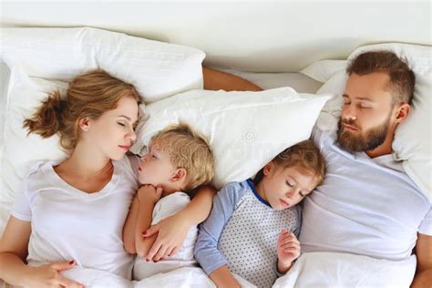 Healthy Sleep. Happy Family Parents and Children Sleeping in White Bed ...