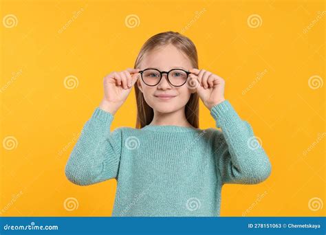 Cute Girl In Glasses On Orange Background Stock Image Image Of Nerd