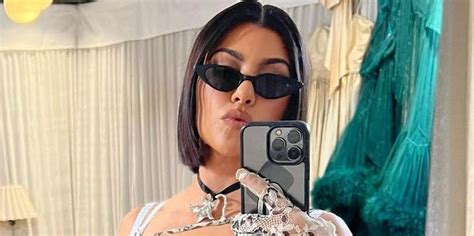 Kourtney Kardashian Wears Sequin Bikini With Holographic Pants