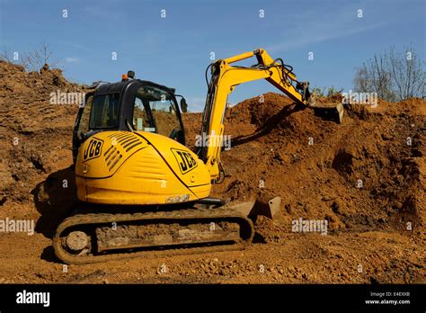 JCB Digger Moving Earth On A Construction Site Stock Photo Alamy