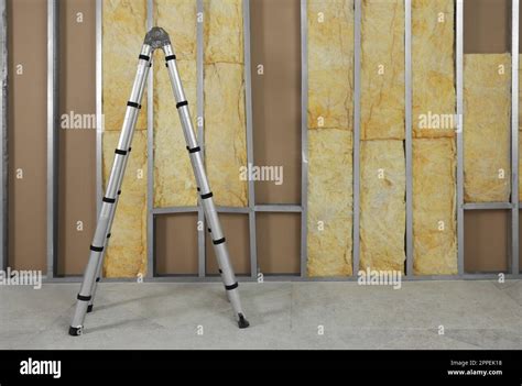 Ladder Near Wall With Metal Studs And Insulation Material Indoors Stock