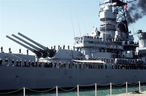 Crew Members Man The Rail Aboard The Battleship Uss Iowa Bb As It